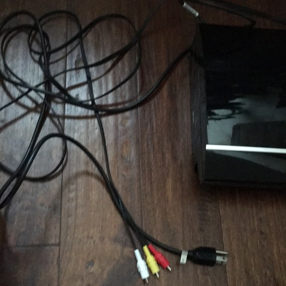 A PlayStation 3 and controller with all the cords. - Picture 3 of 6